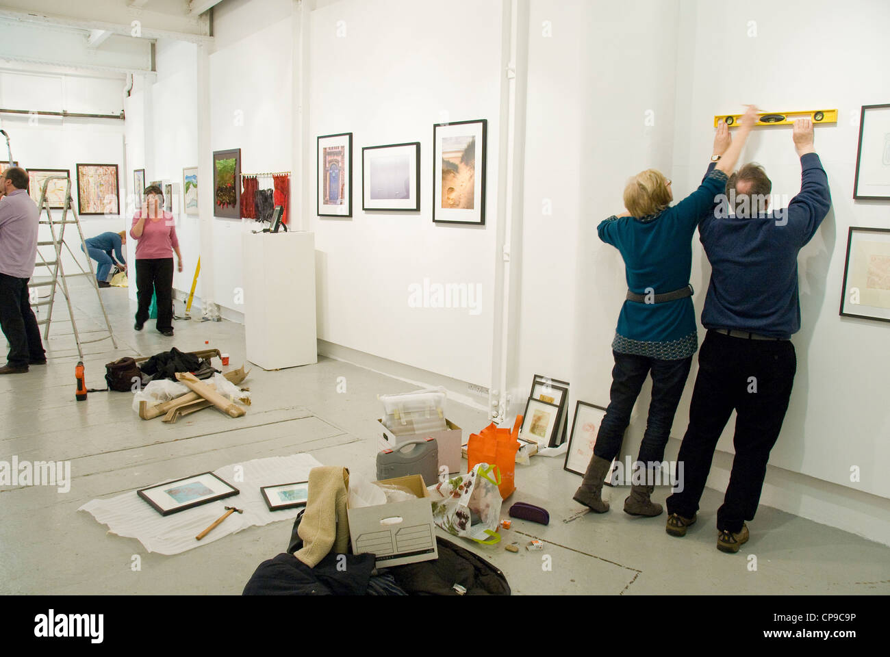 Artists setting up exhibition, Gallery, Bristol, England, UK Stock