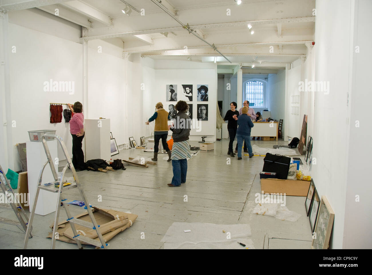 Artists setting up exhibition, Gallery, Bristol, England, UK Stock