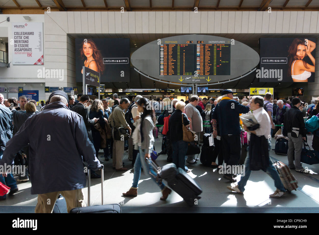 Venice Marco Polo Airport - departure gates and advertising with crowds  Stock Photo - Alamy