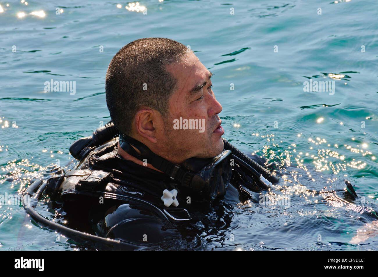 Japanese SCUBA Diving diver floating positively buoyant at the ocean