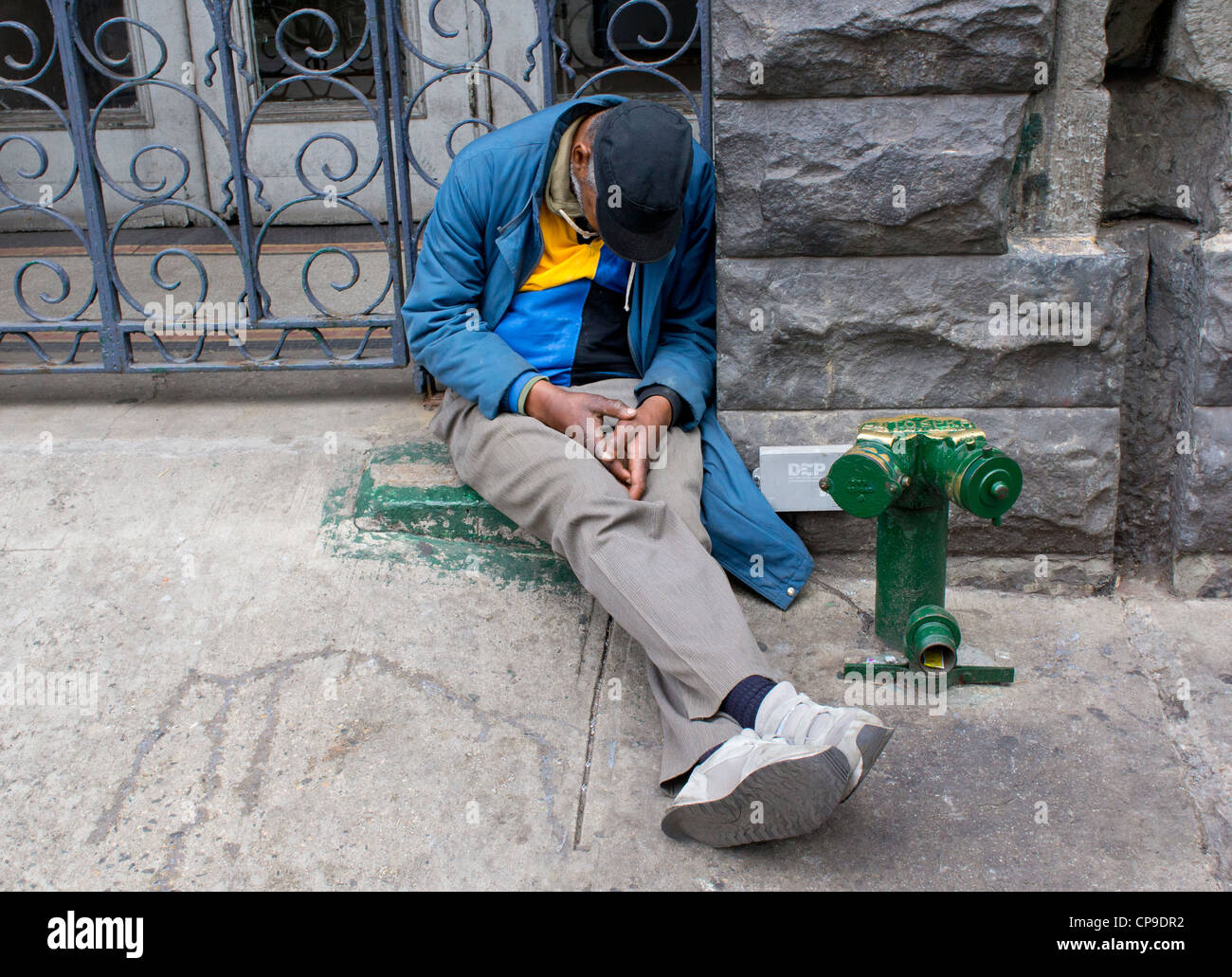 Man sleeping on the street on the Bowery in New York City Stock Photo ...