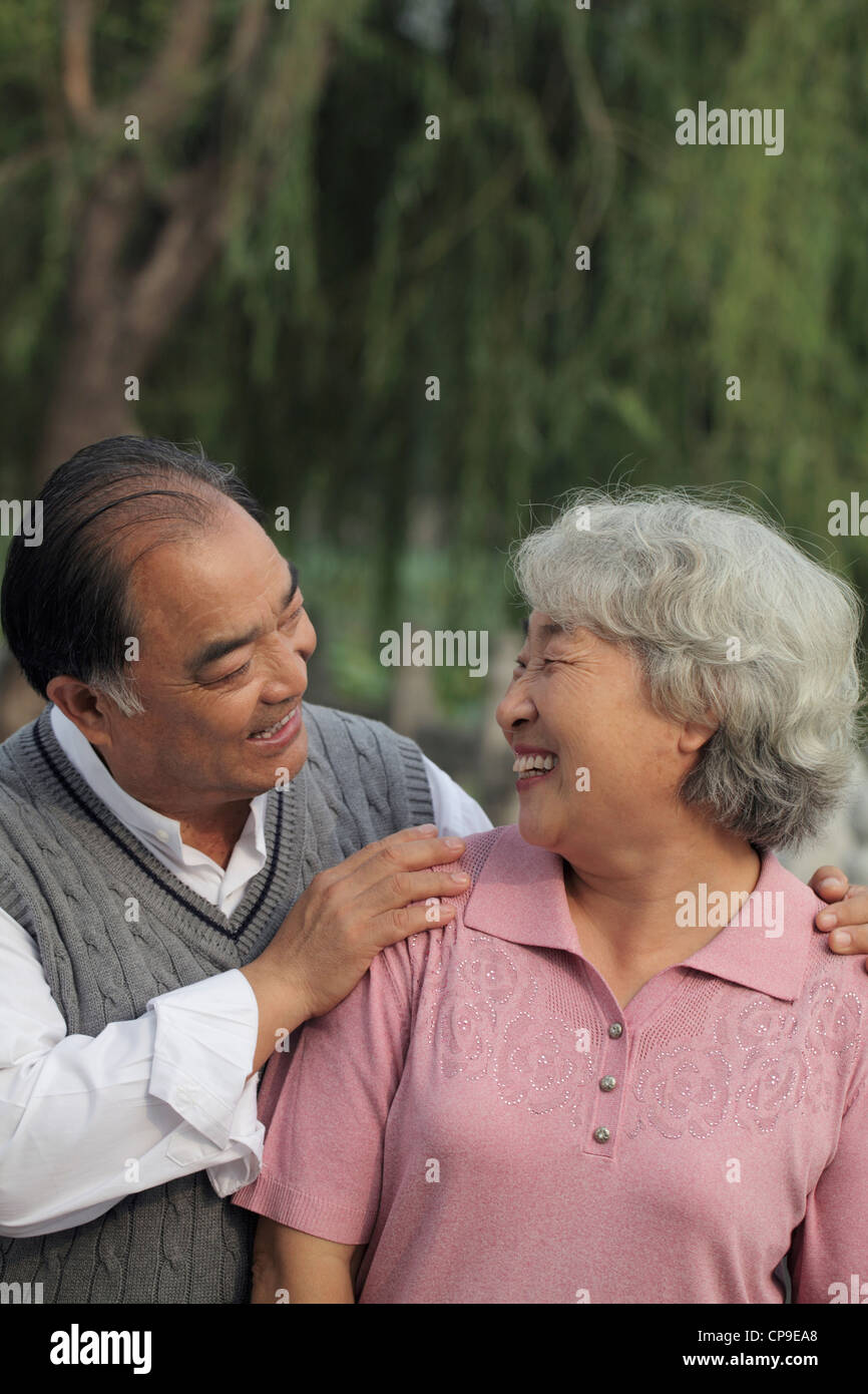 Older couple smiling at each other Stock Photo - Alamy