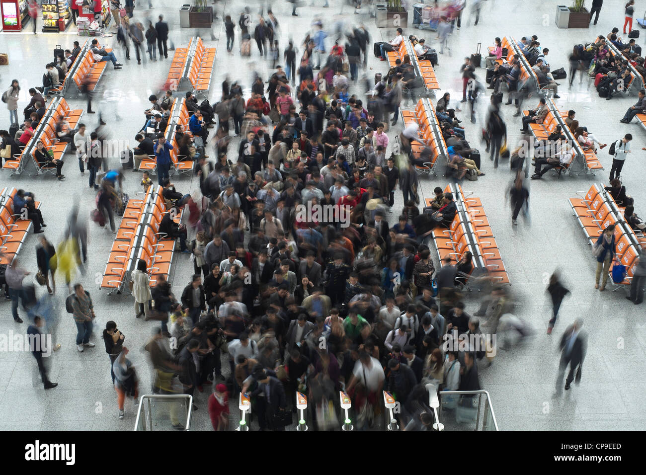 Passengers queuing at ticket gates at Hongqiao railway station in Shanghai China Stock Photo