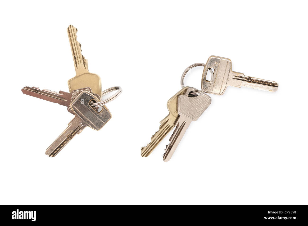 Two sets of keys on ring isolated on white background Stock Photo