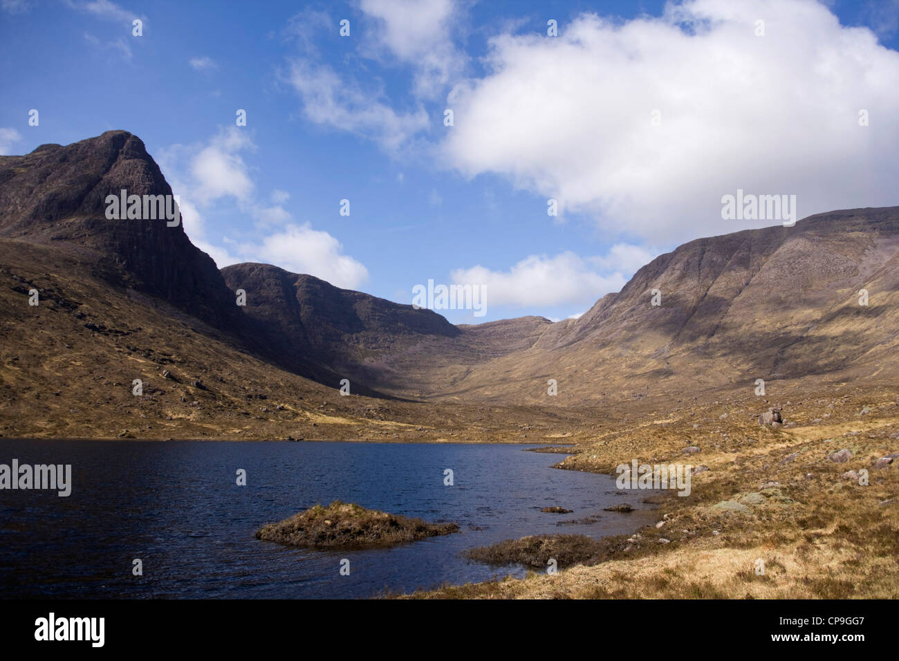 Looking across Loch Coire nan Arr reservoir  towards A'Chioch  and Beinn Bhan. Stock Photo
