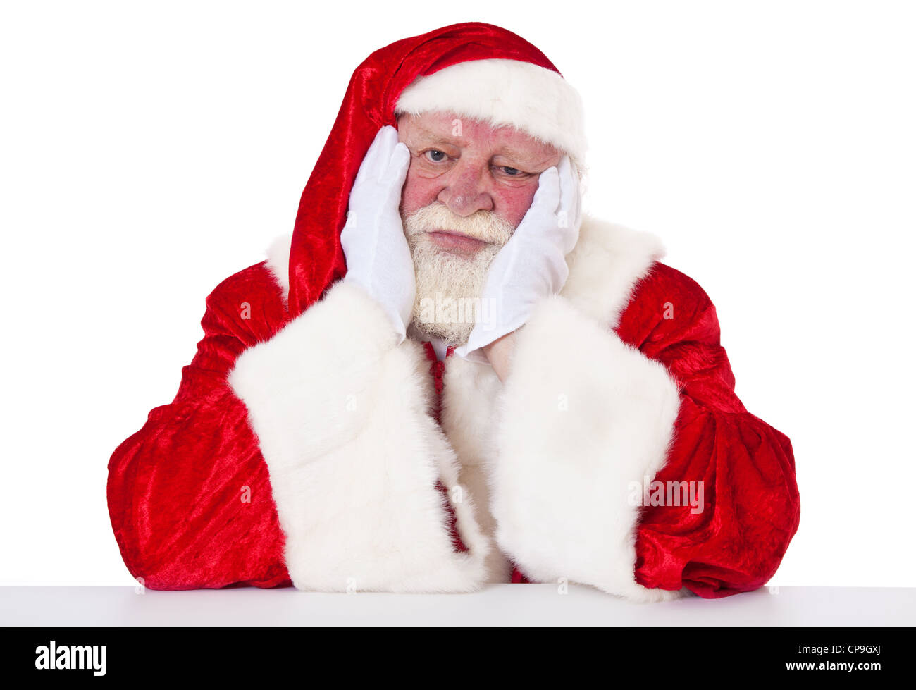 Santa Claus wears a face mask covering while waiting for children