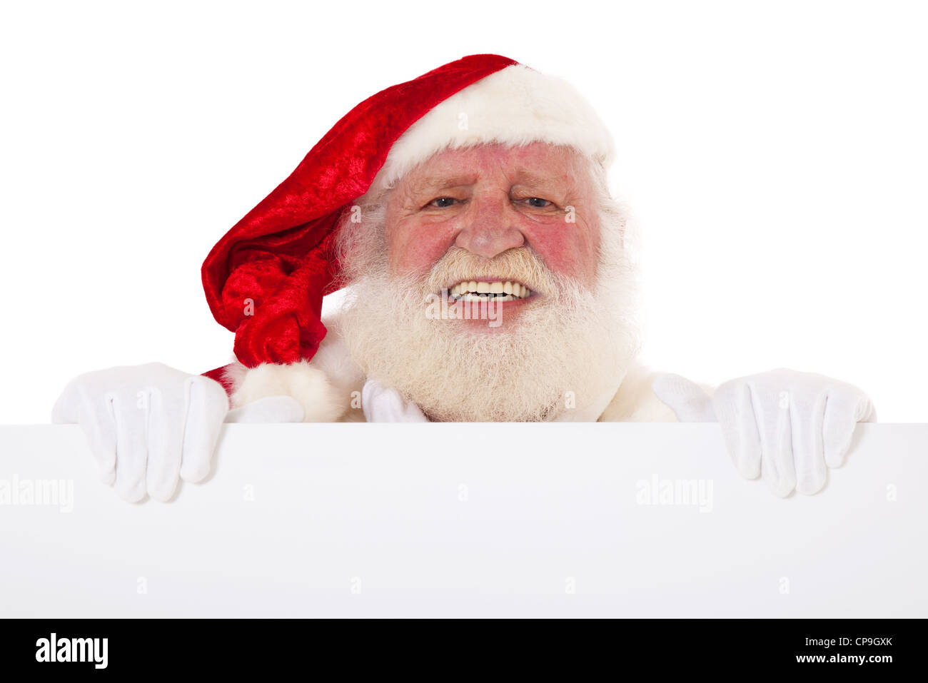 Santa Claus in authentic look behind white sign. All on white ...
