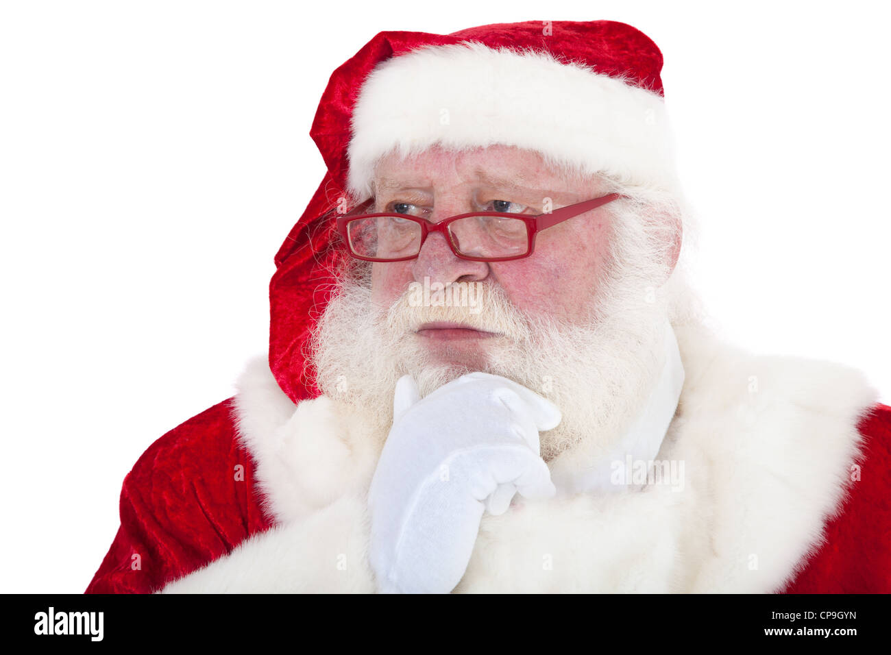 Santa Claus in authentic look deliberates a decision. All on white background. Stock Photo