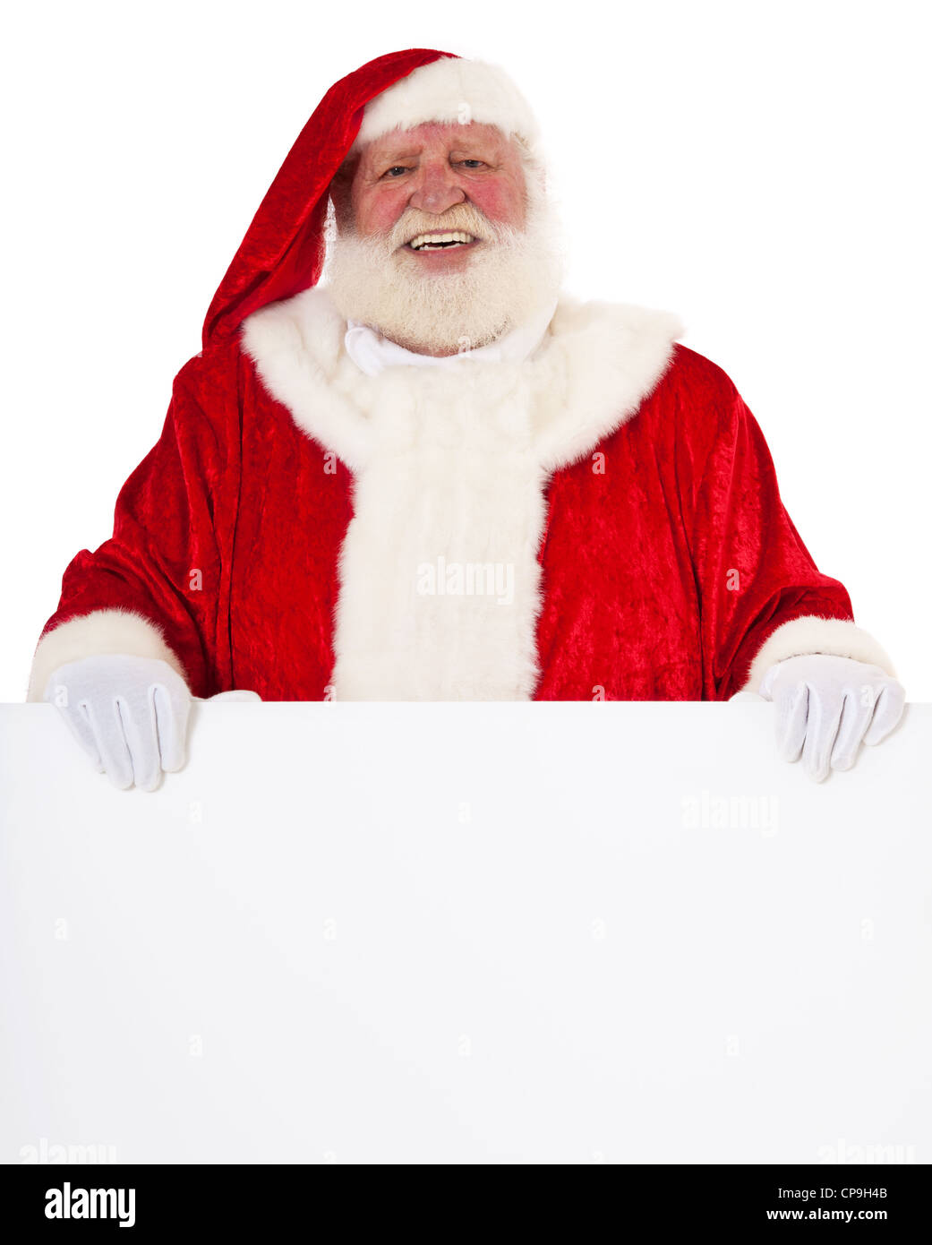 Santa Claus in authentic look behind blank white sign. All on white background. Stock Photo