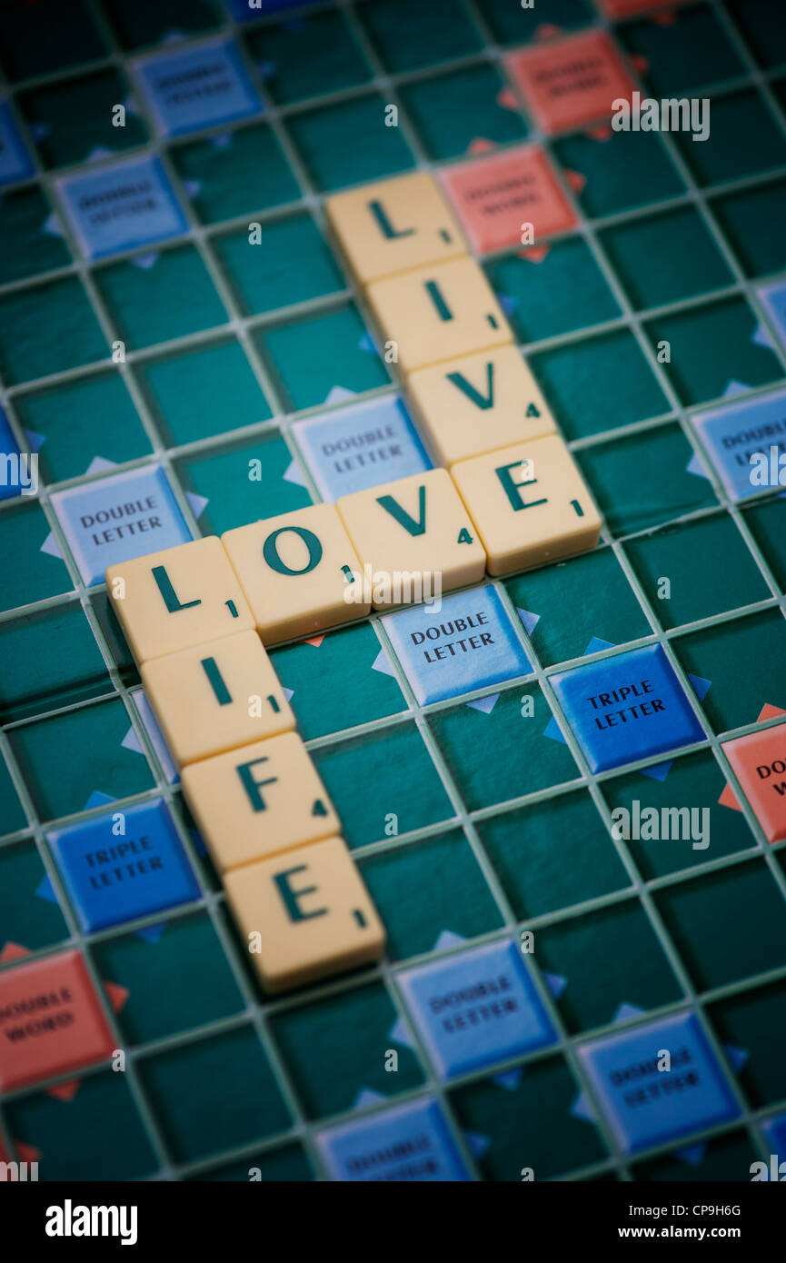 Scrabble letters with the words LOVE, LIFE and LIVE Stock Photo