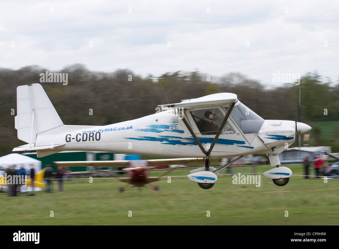 Aerosport Ikarus C42 registration G-CDRO takes off from Popham airfield near Basingstoke Hampshire Englan Stock Photo