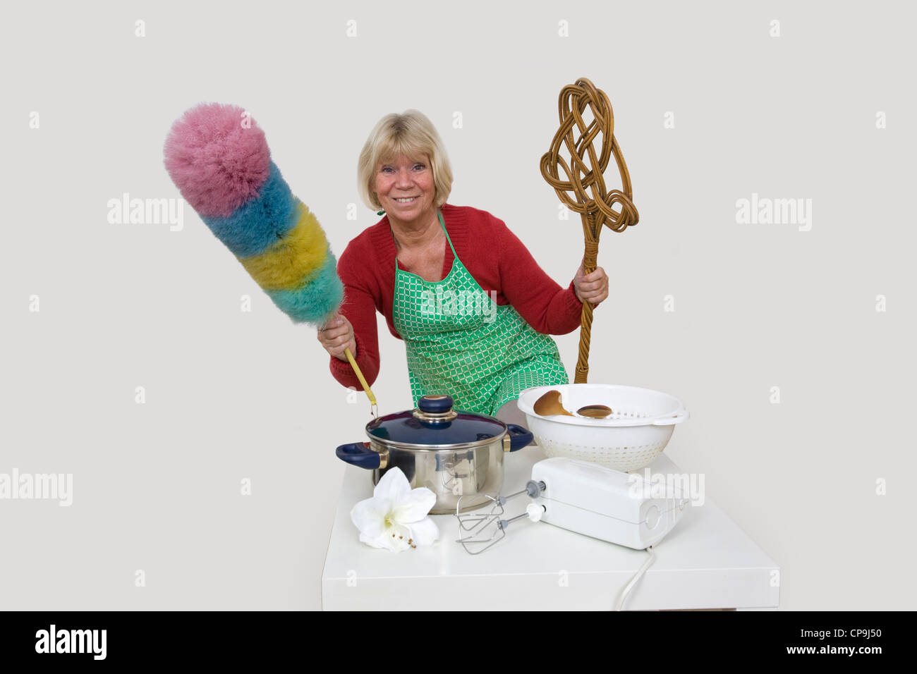Senior woman presents kitchen utensils Stock Photo Alamy
