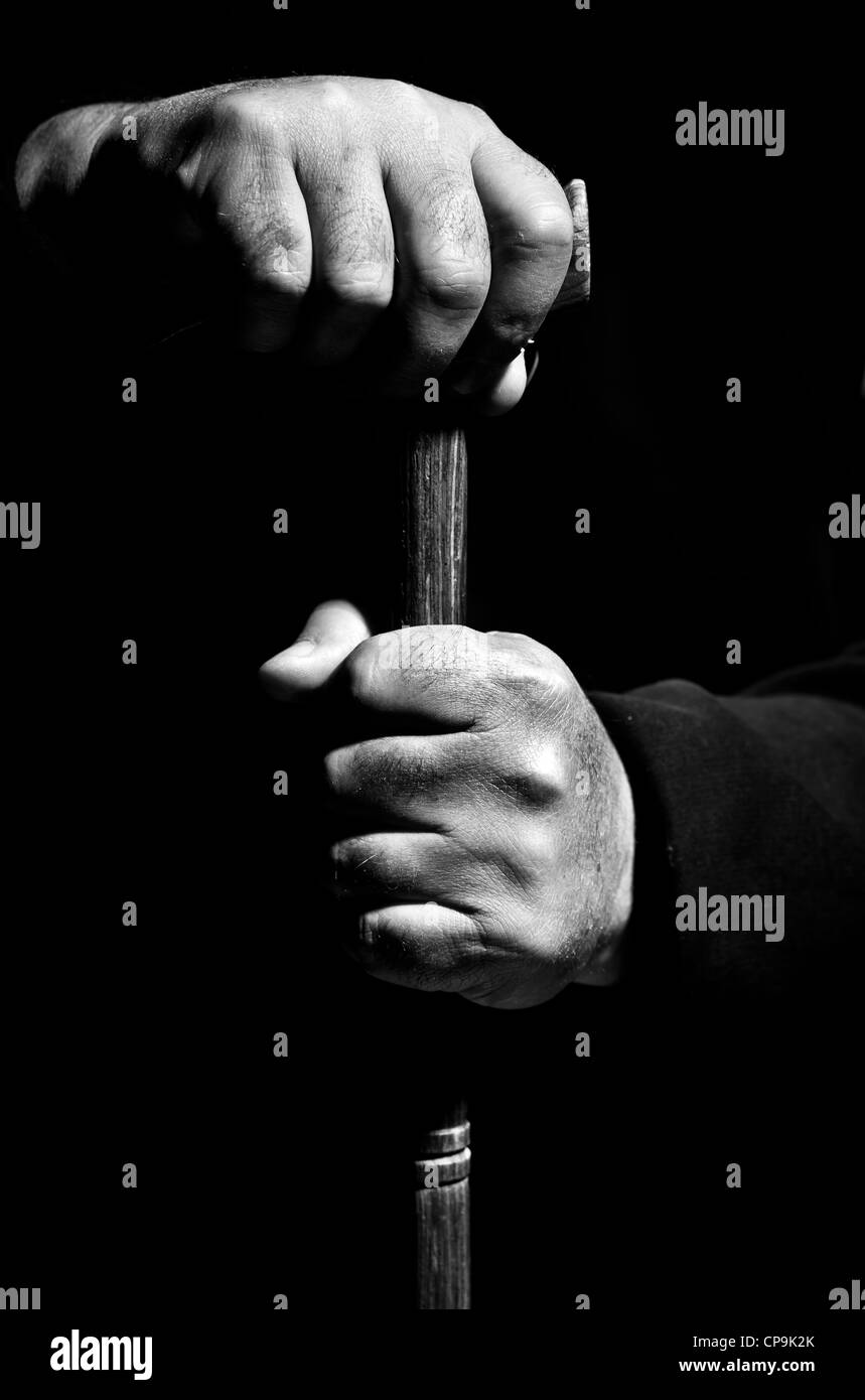 Man holding a cane Stock Photo