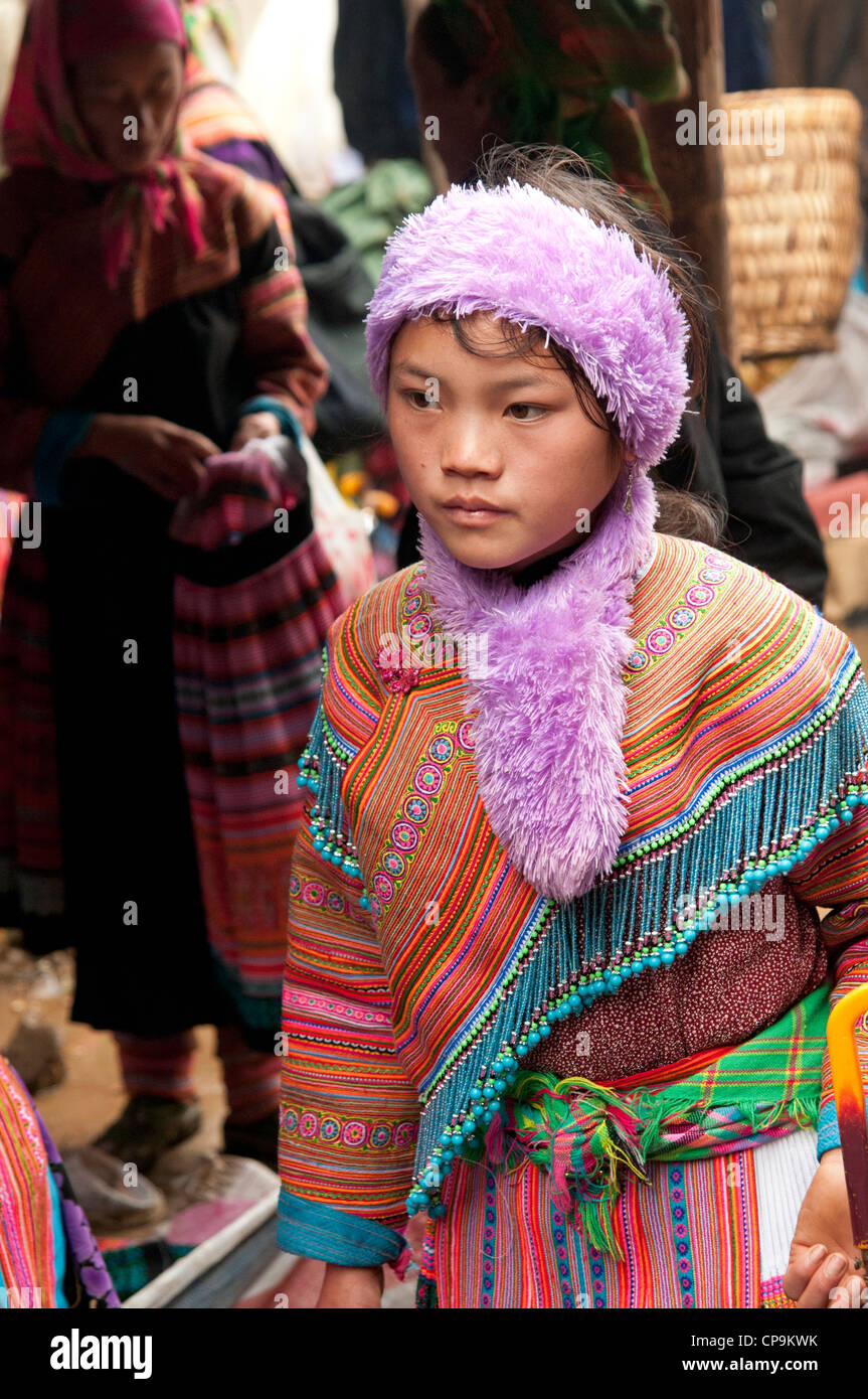 Flower Hmong girl wearing traditional tribal costume in Muong Khuong market North Vietnam Stock Photo