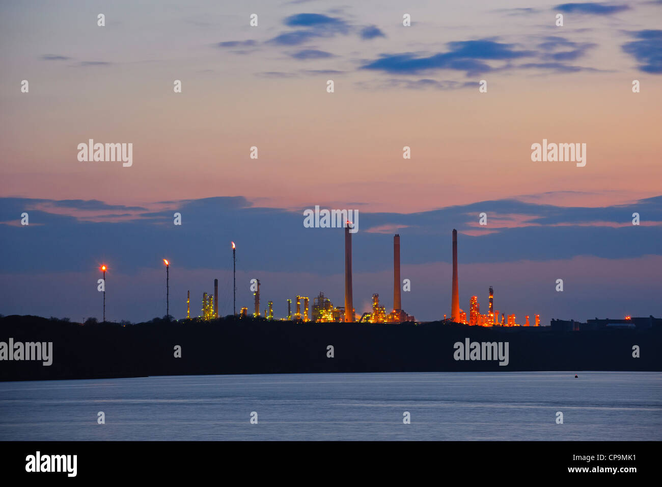 Oil refinery at dusk near Milford Haven, Wales, UK Stock Photo