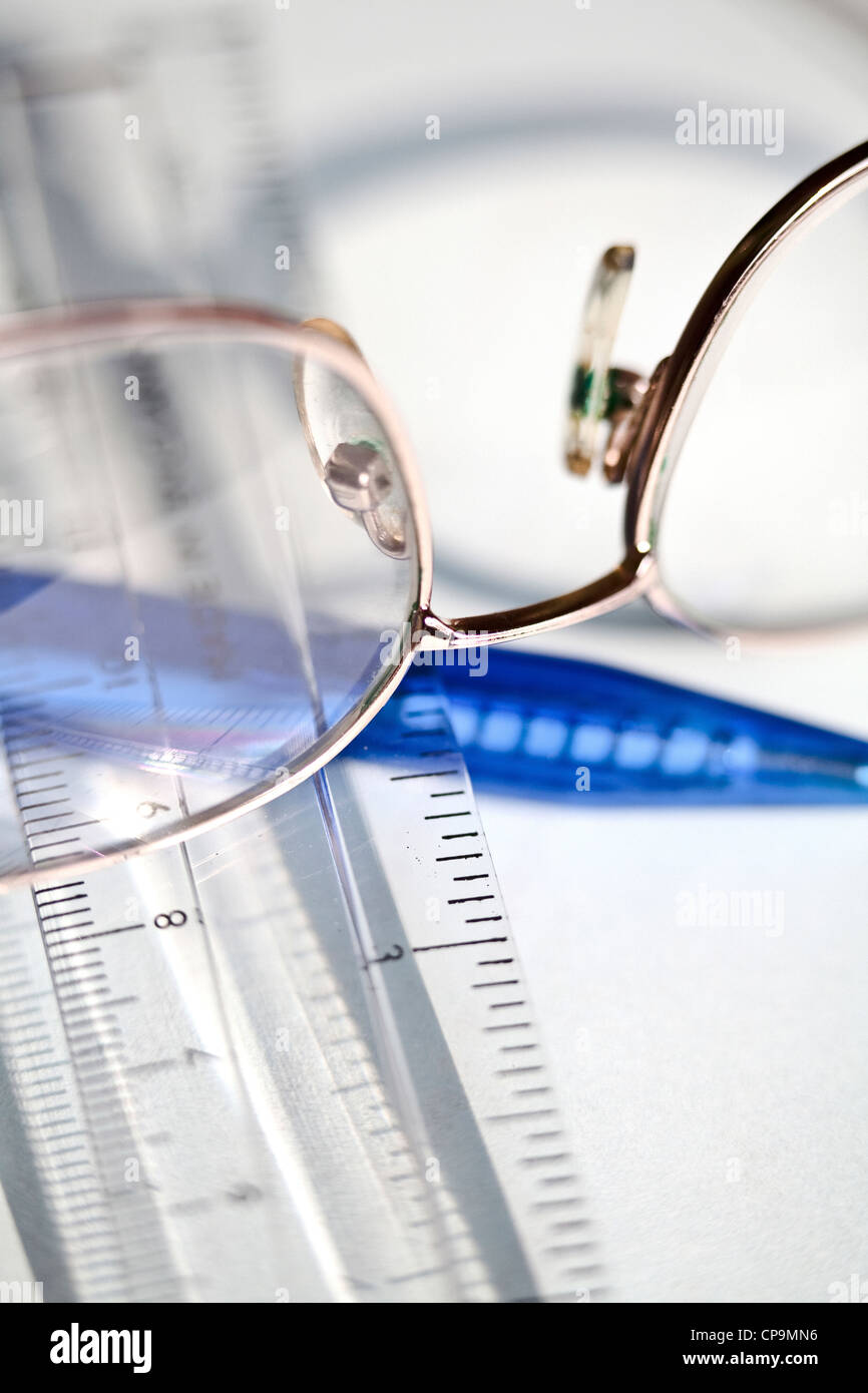 Reading glasses,ruler and pen Stock Photo - Alamy