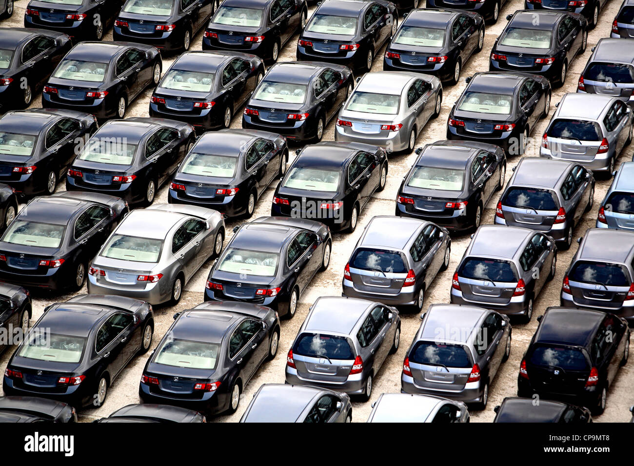 New cars parked on quayside for exporting from the docks at Lisbon