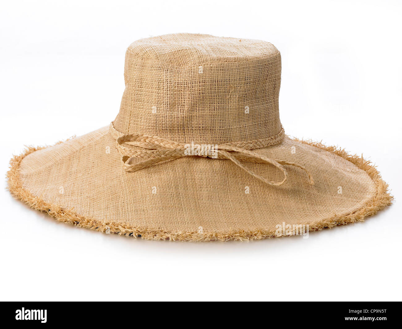 wide brimmed ladies linen look straw colored hat Stock Photo