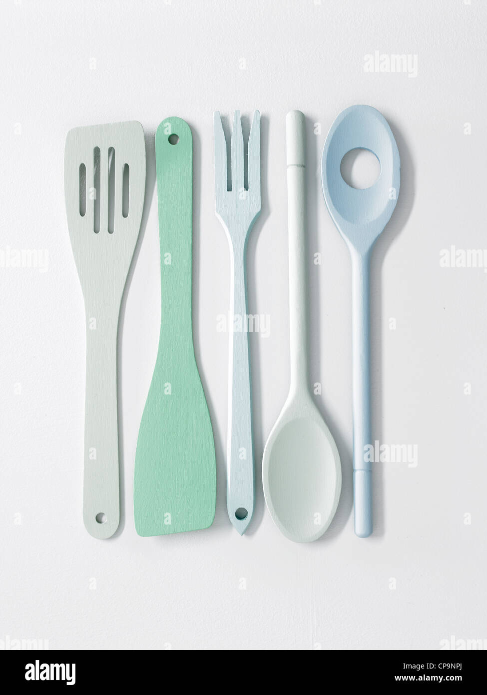 painted colored wooden kitchen utensils Stock Photo