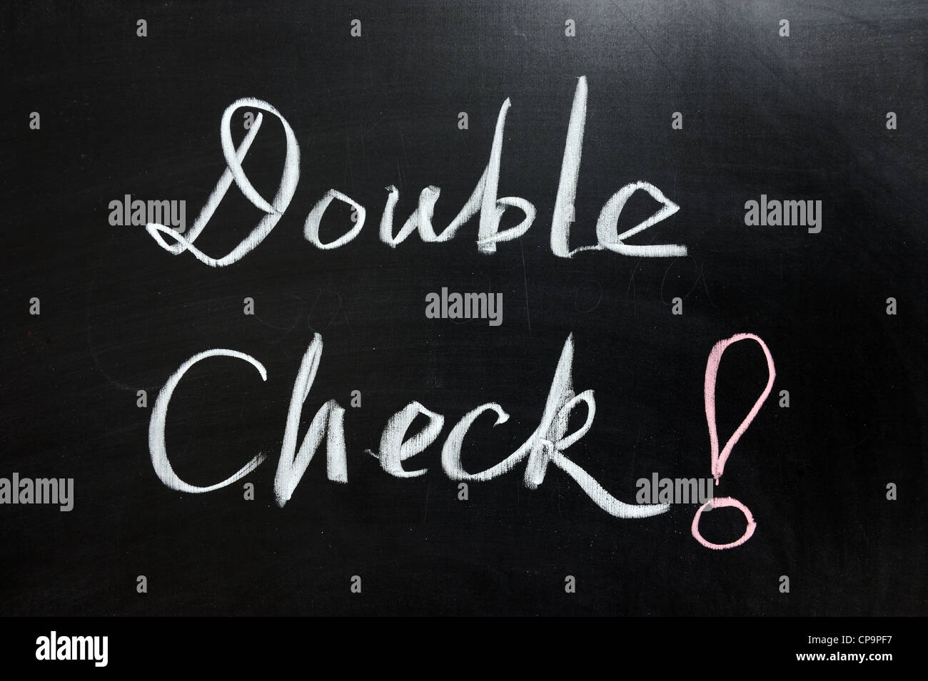Chalk drawing - double check word on the chalkboard Stock Photo - Alamy