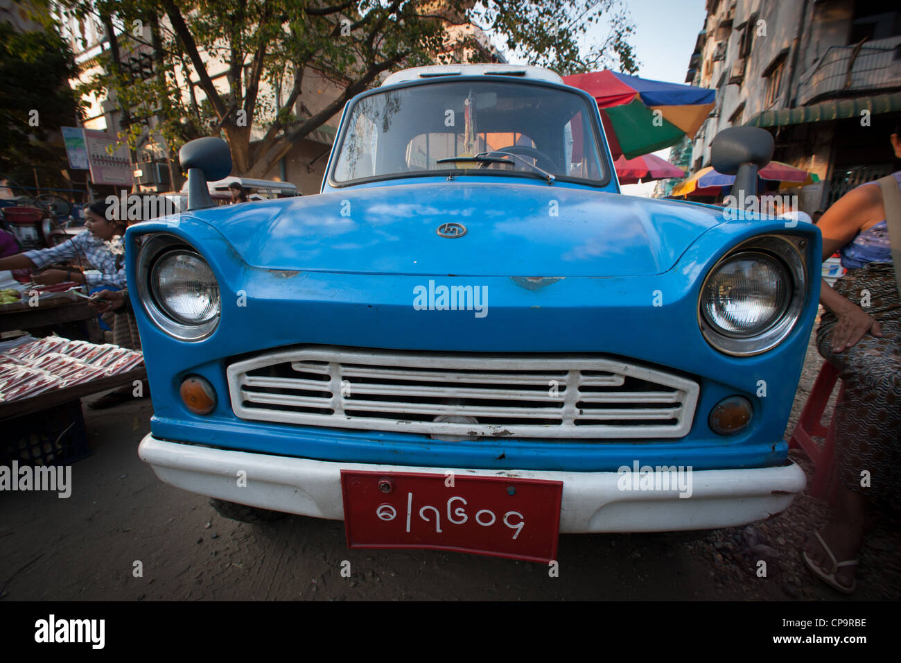 Blue toy like car in downtown Yangon Burma Myanmar Stock Photo Alamy