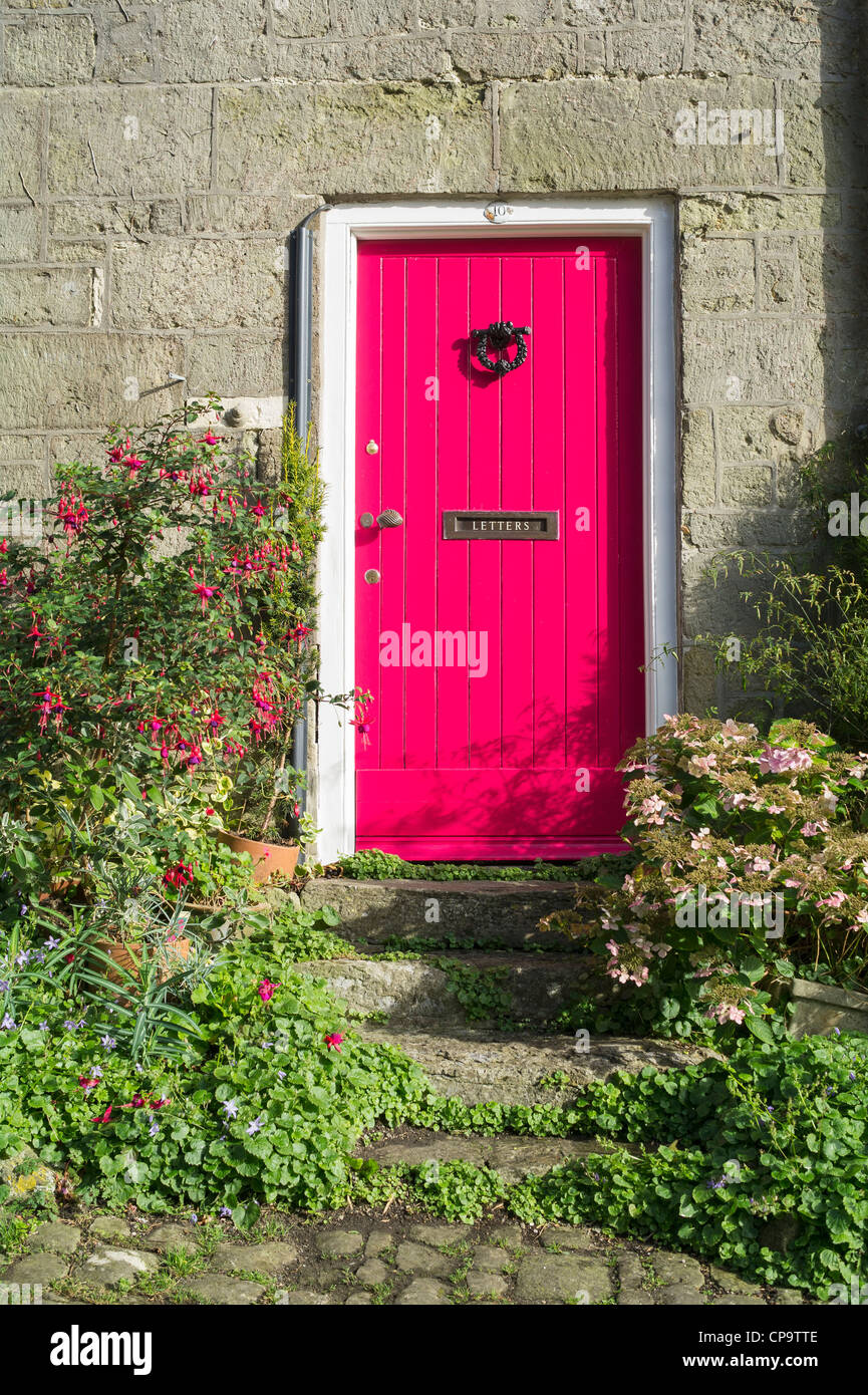 Pink Cottage Door at Gold Hill Shaftesbury Dorset UK Stock Photo
