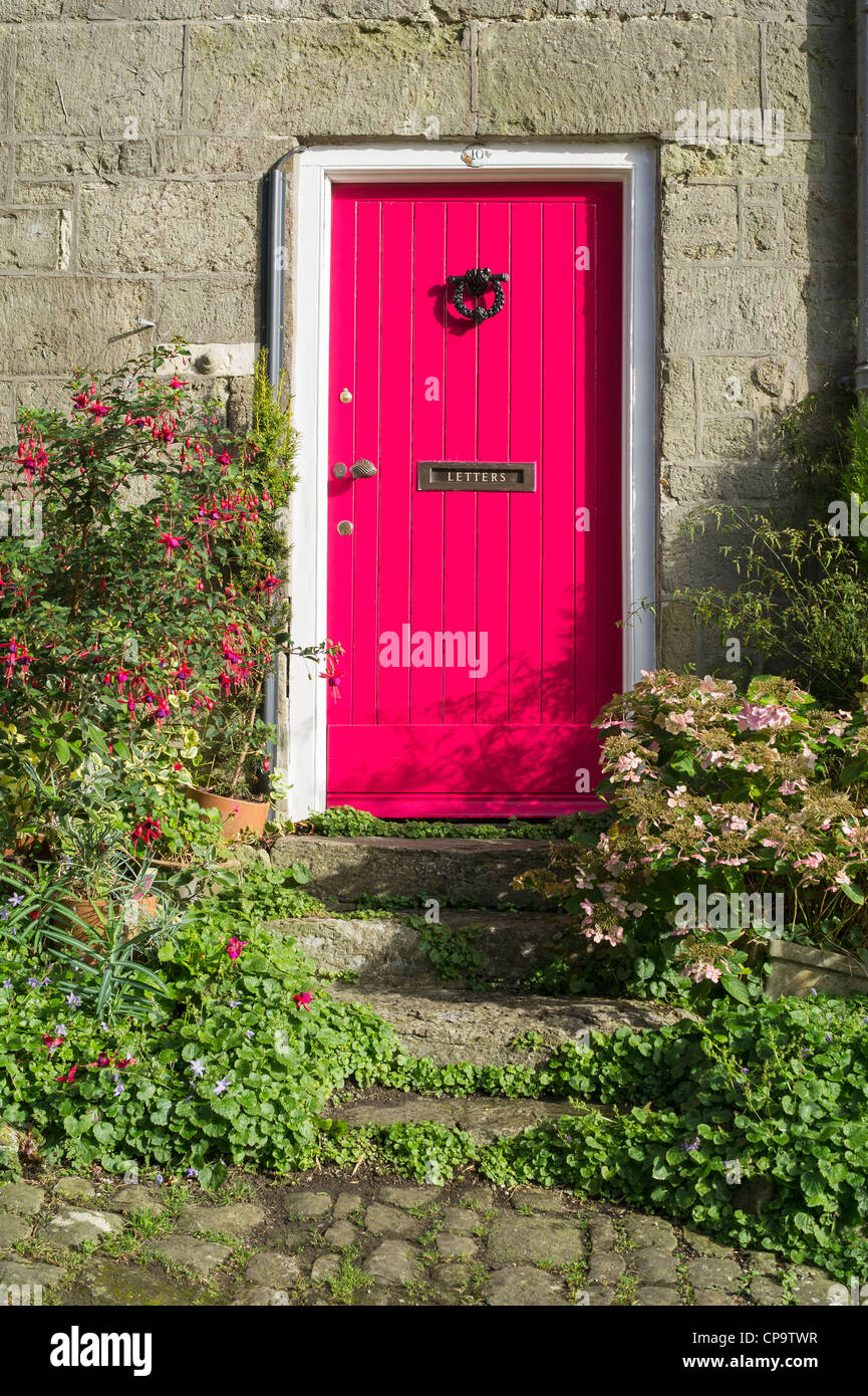 Pink Cottage Door at Gold Hill Shaftesbury Dorset UK Stock Photo