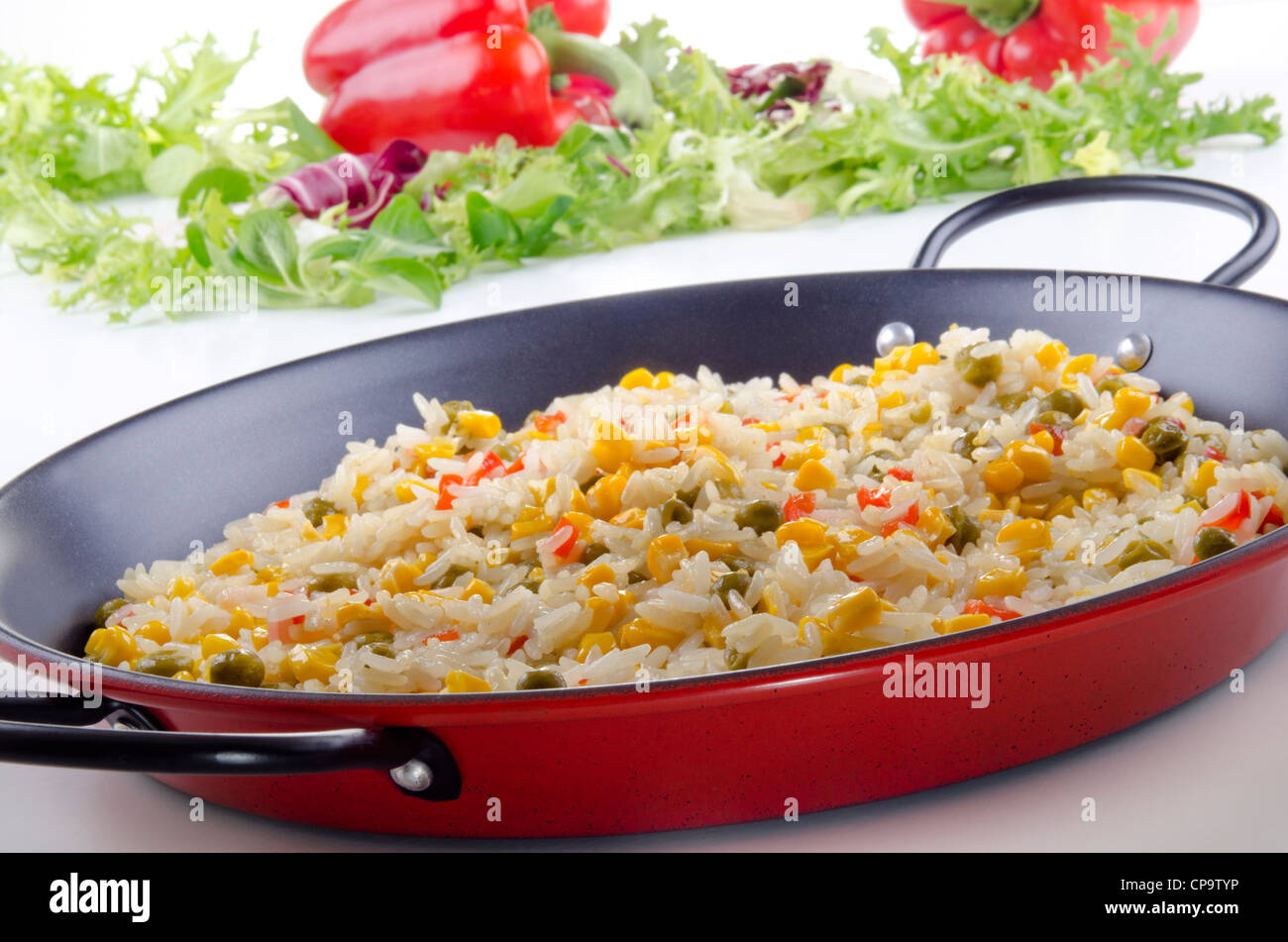 spanish vegetable paella with bell pepper, sweet corn and pea Stock Photo