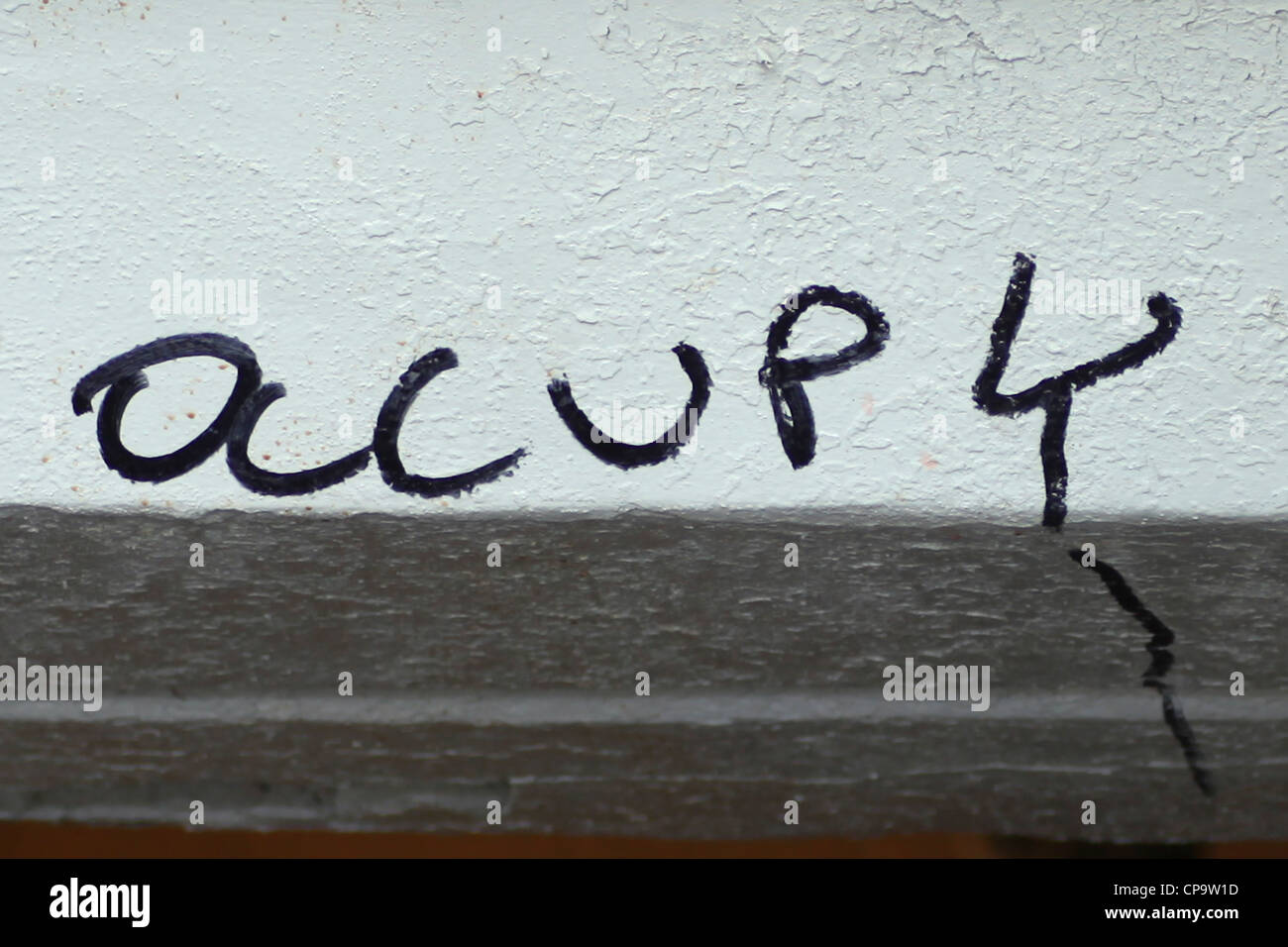 Occupy graffiti on wall above Union Square MTA station. Stock Photo