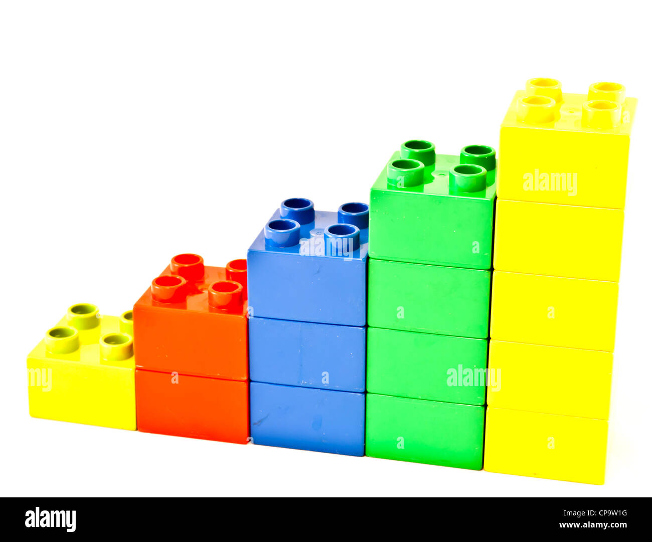 Plastic building blocks on white background. Bright colors. Stock Photo