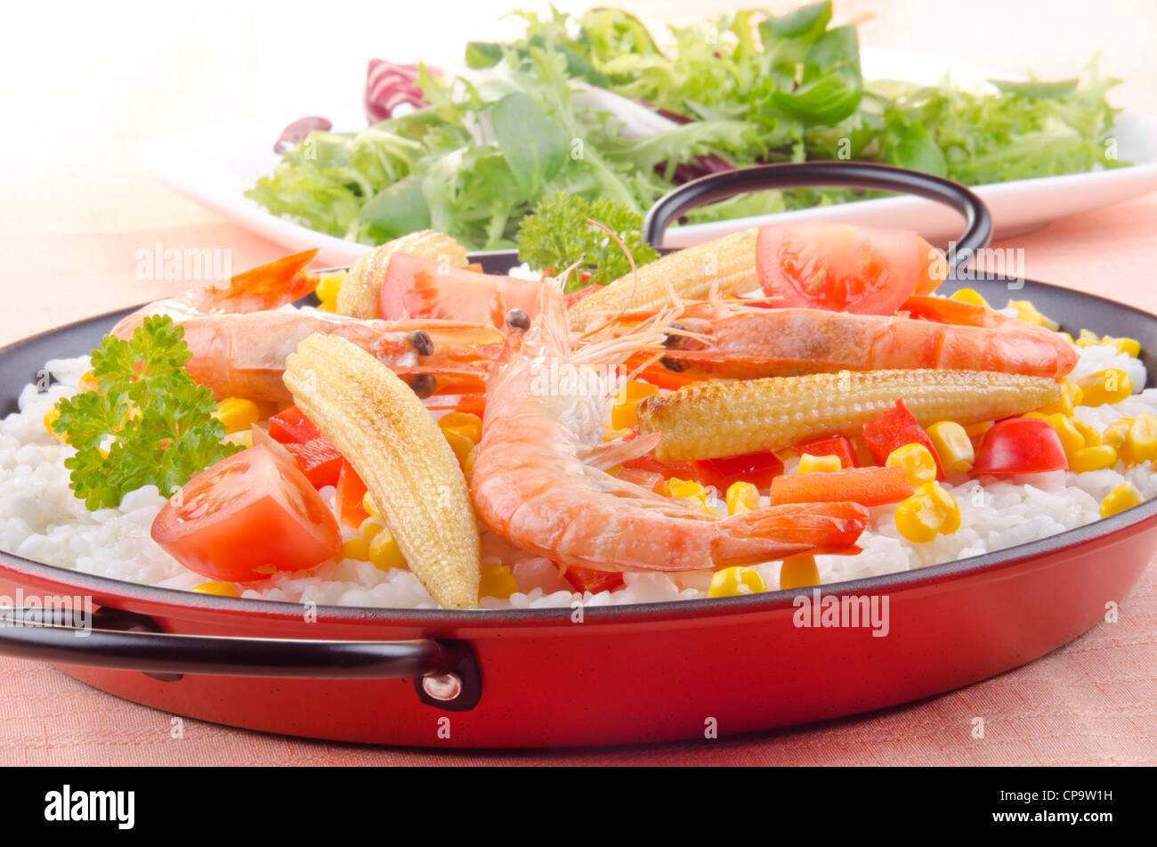 spanish vegetable paella with bell pepper, babycorn and tomato Stock Photo