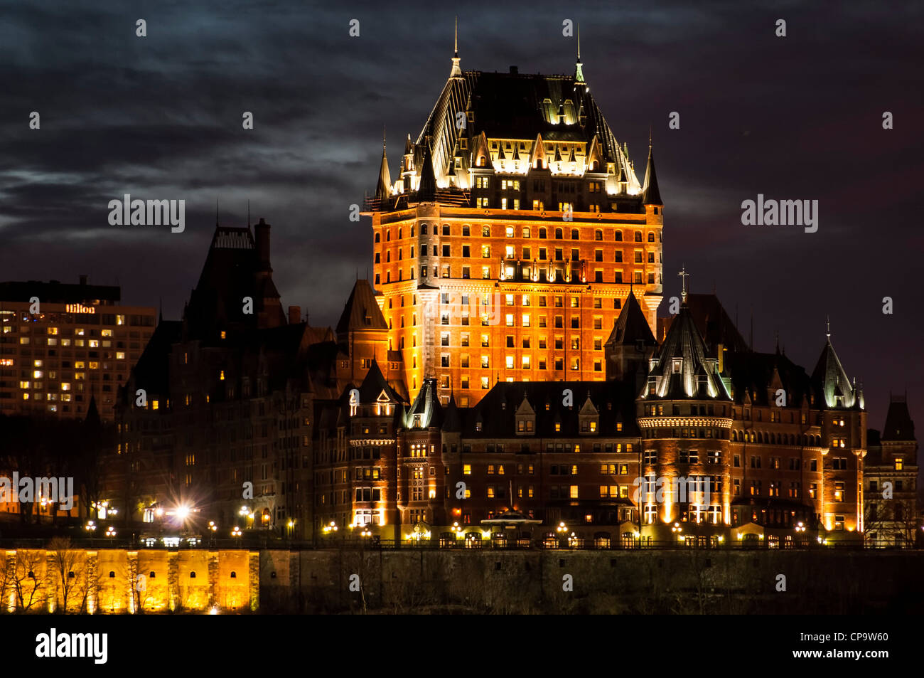 Chateau Frontenac and Old Quebec skyline at sunset from across the Saint Lawrence River in Levis, Quebec, Canada. Stock Photo