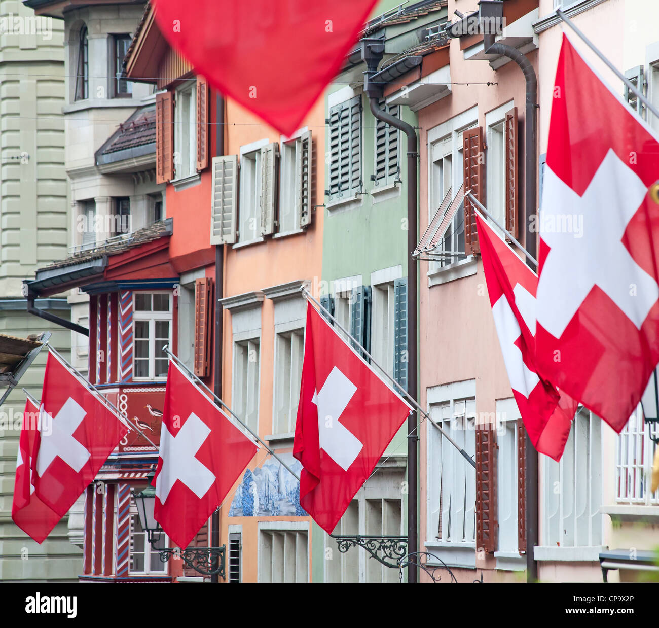 Ancient street Augustinergasse in Zurich decorated with swiss flags Stock Photo