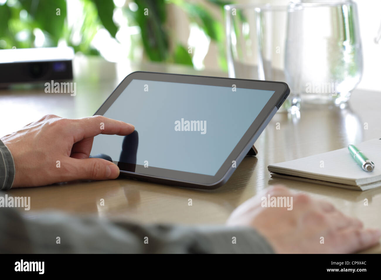 Touching screen of a digital tablet Stock Photo - Alamy