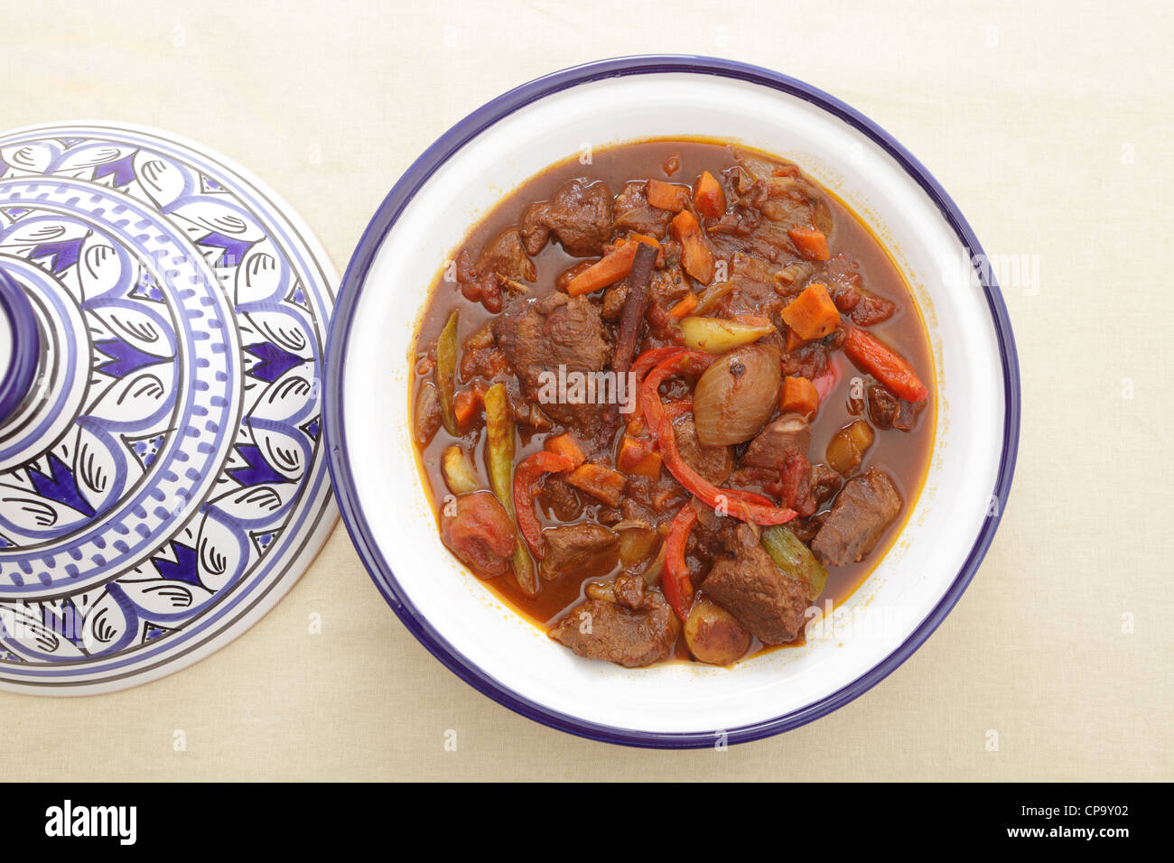 A moroccan beef tagine served in the traditional tagine dish, seen from