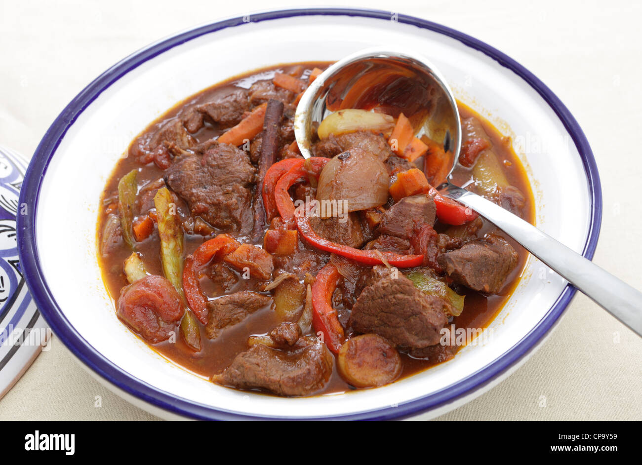 A moroccan beef tagine served in the traditional tagine dish Stock