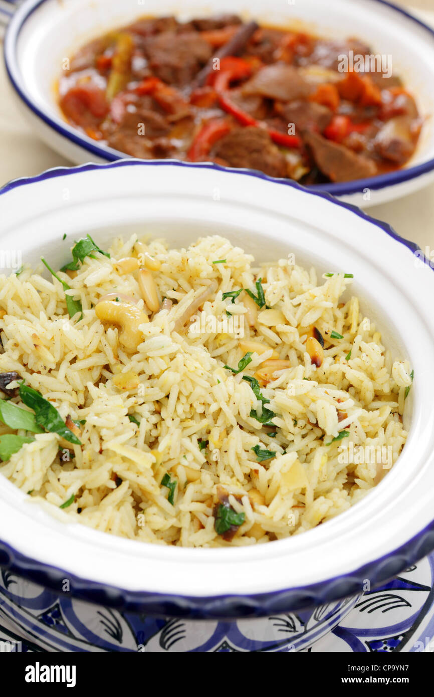 Moroccan rice with nuts and onion and a spicy beef tagine stew Stock