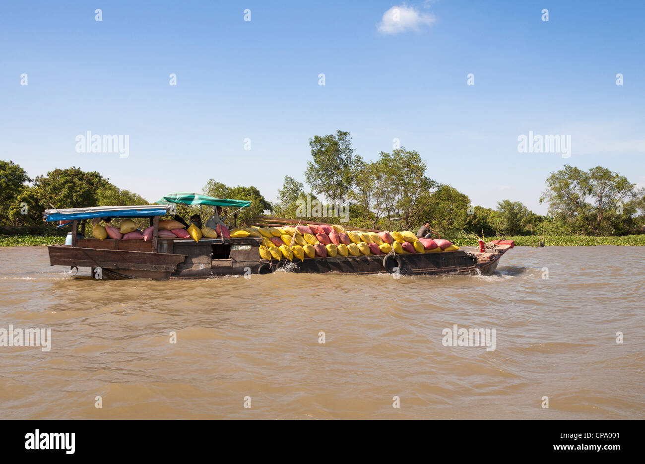 Fully laden cargo boat, Vinh Long, Mekong River Delta, Vietnam Stock Photo