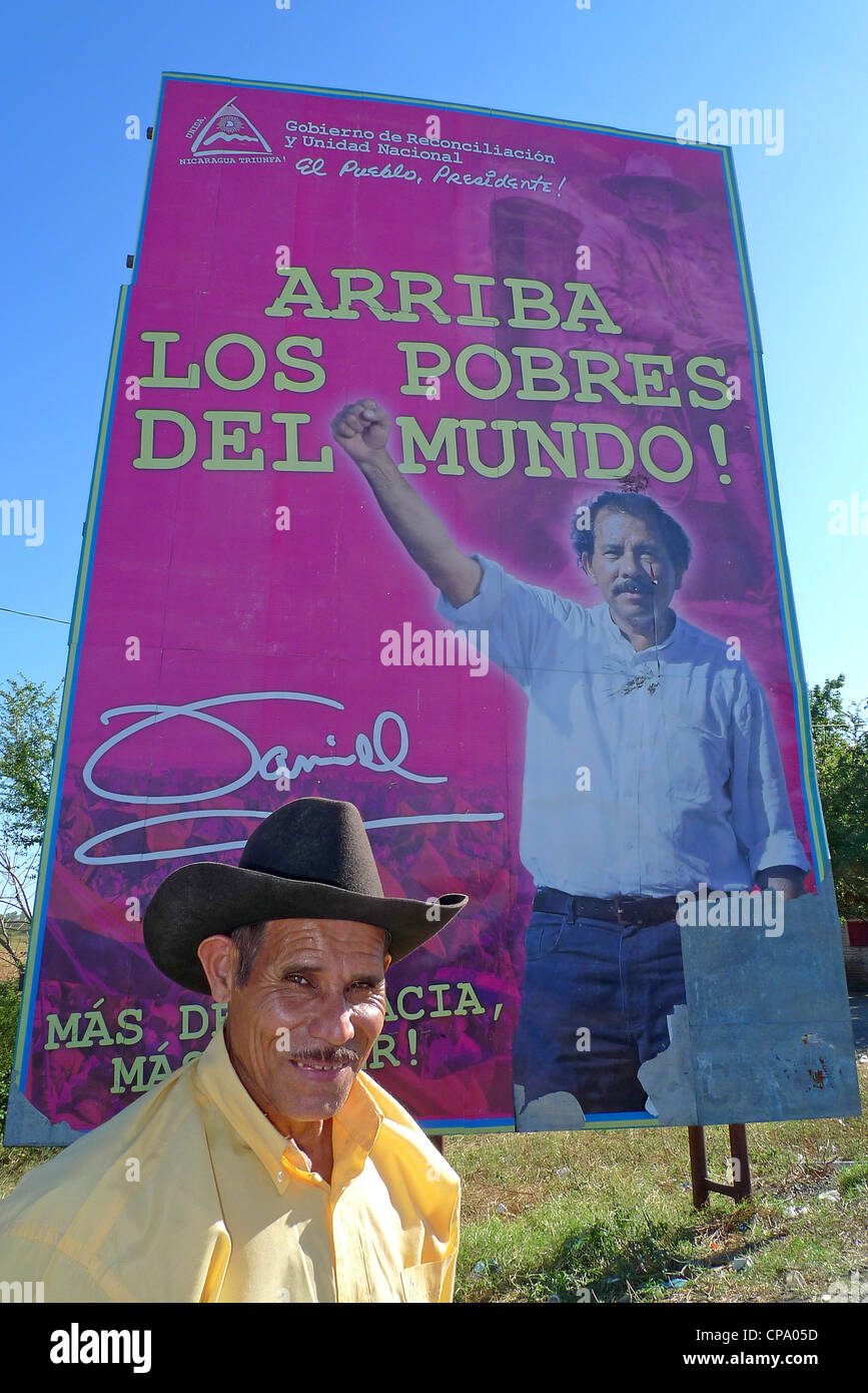 Nicaragua happy man smiling with President Daniel Ortega election posters in background Stock Photo