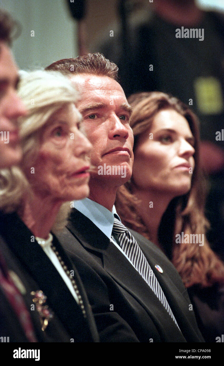 Actor Arnold Schwarzenegger sits with his wife Maria Shriver and mother-in-law Eunice Kennedy Shriver at the dedication of the Peace Corps headquarters September 15, 1998 in Washington, DC. Stock Photo