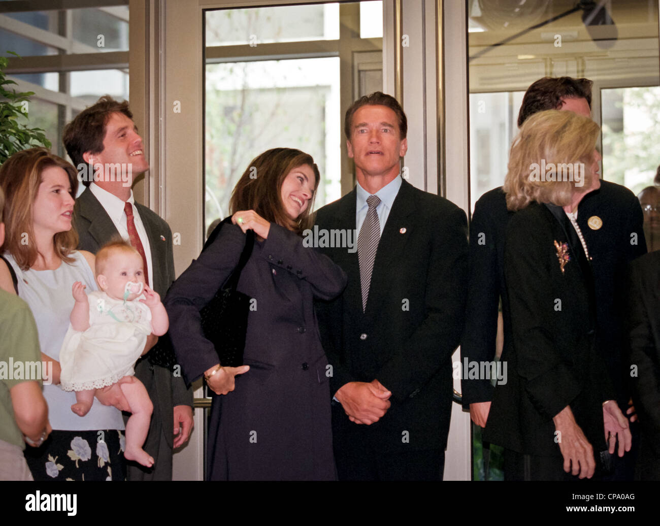 Actor Arnold Schwarzenegger with his wife Maria Shriver at the dedication of the Peace Corps headquarters September 15, 1998 in Washington, DC. Stock Photo