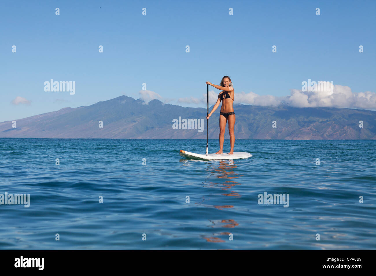 Stand up paddling at Napili Bay, Maui, Hawaii with Molokai in the