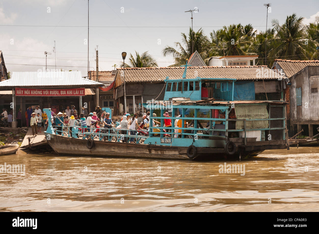 People on a small ferry boat, Cai Be, Mekong River Delta, Vietnam Stock ...