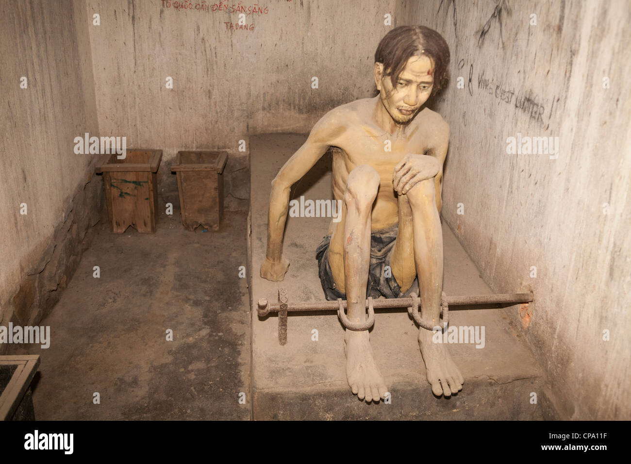 Model of prisoner in a tiger cage, War Remnants Museum, Ho Chi Minh City, (Saigon), Vietnam Stock Photo