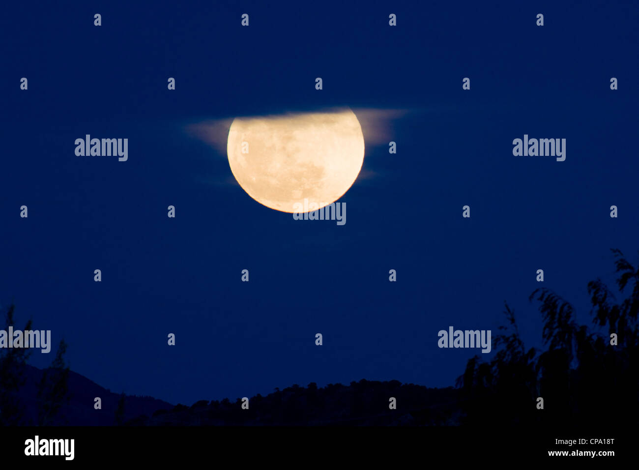 Perigree full moon, or supermoon, rises over Salida, Colorado, USA. Moon is closer to earth in orbit than normal. Stock Photo