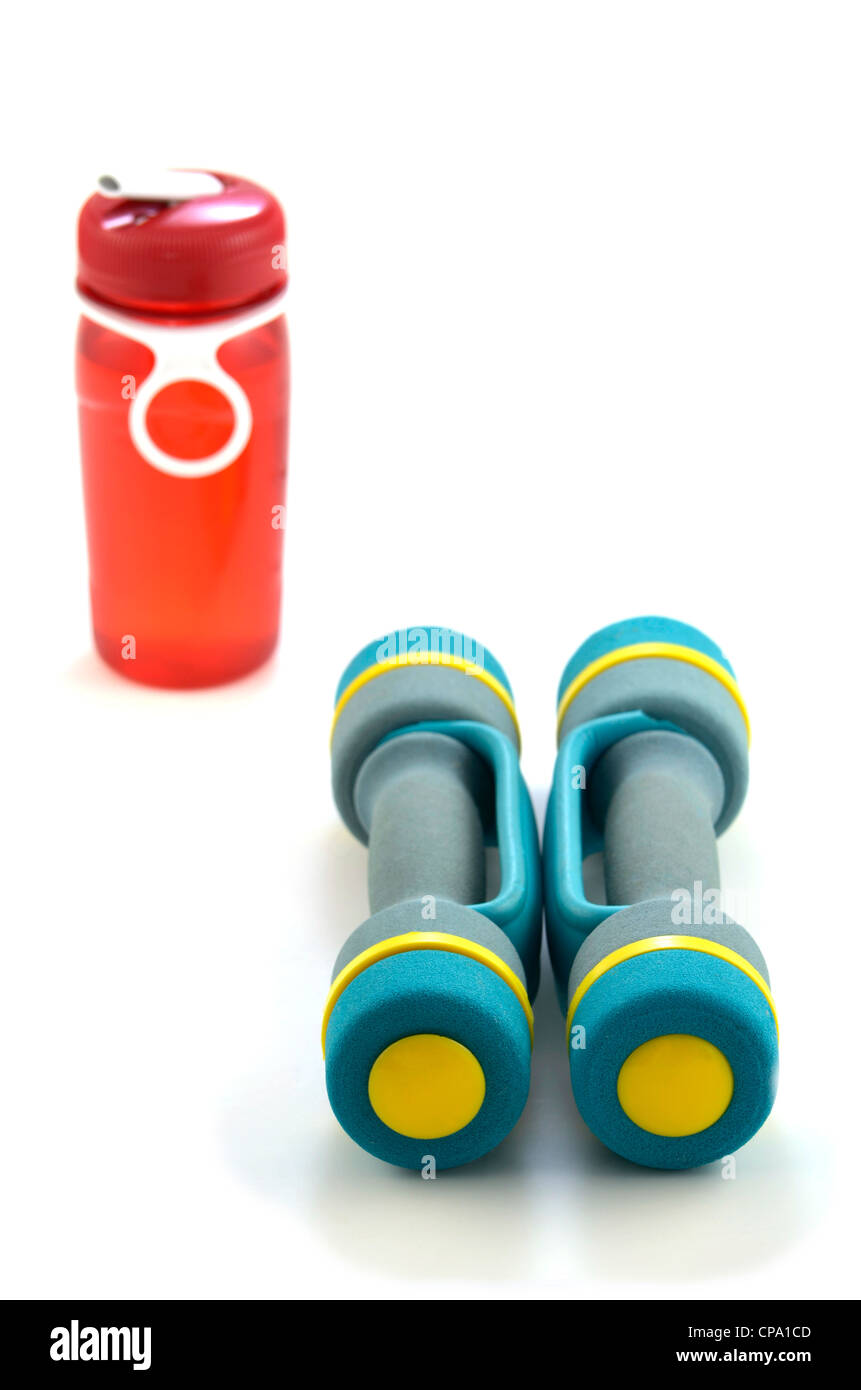 Small hand weights and water bottle on white background Stock Photo Alamy
