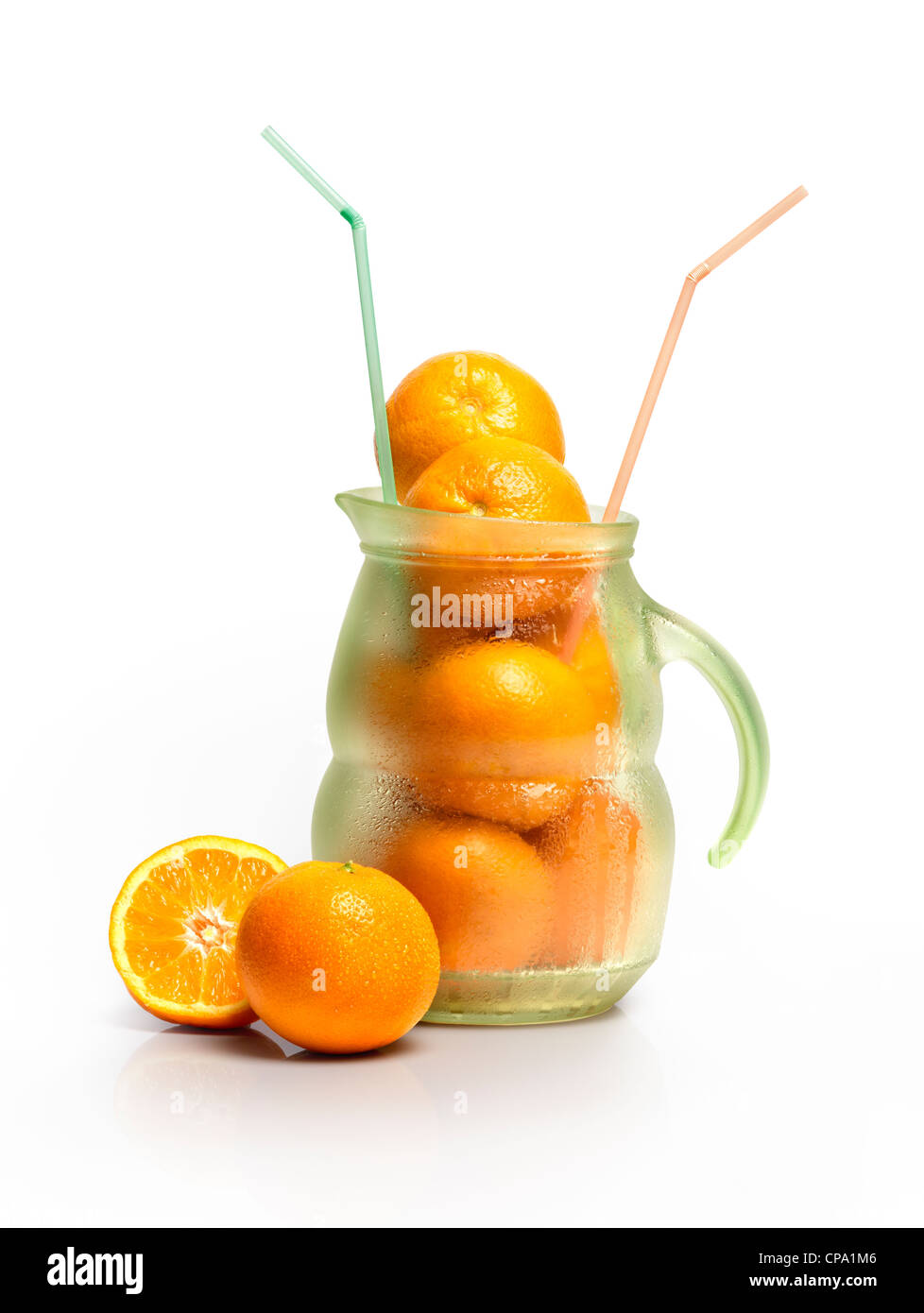 Glass Full Of Orange Juice, Carafe With Fresh Juice, Straw And Fresh  Oranges In The Background On Wooden Table Stock Photo, Picture and Royalty  Free Image. Image 105485816.