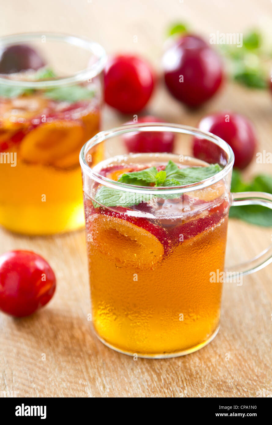 Plum juice with fresh plum and mint Stock Photo