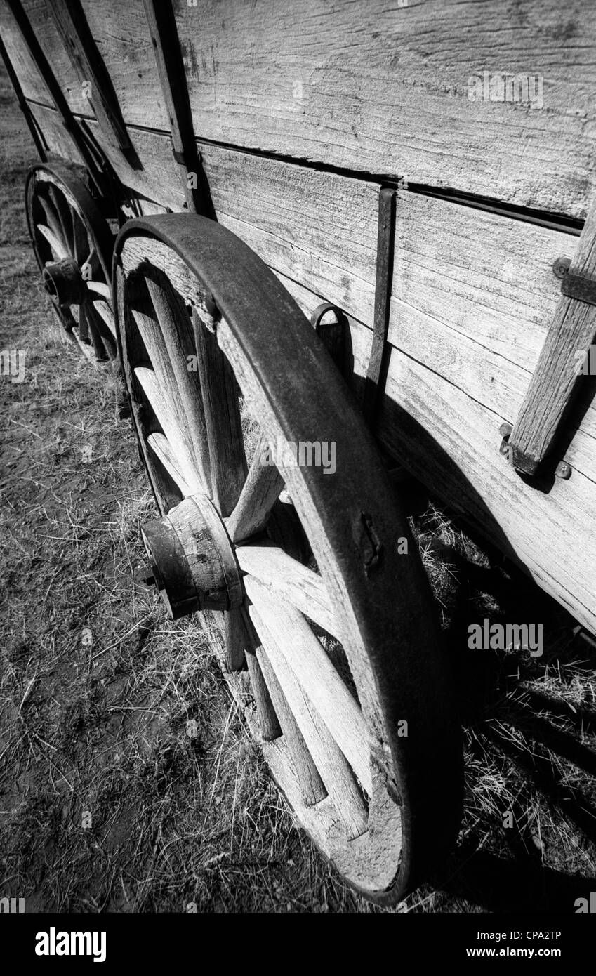 Abandoned wagon left behind in the Badlands Canada. Dry, arid conditions in the desert environment have left it well preserved Stock Photo