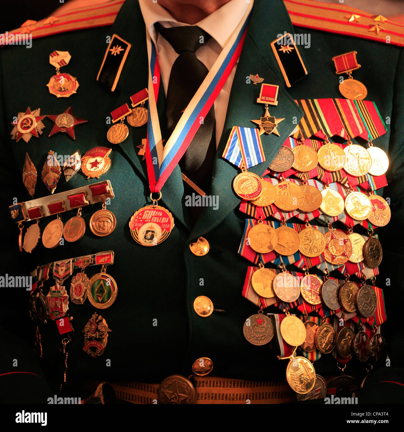 A soviet Jewish World War II veteran with medals pinned in his old uniform during ceremony marking the Allied Victory over Nazi Germany in Israel Stock Photo